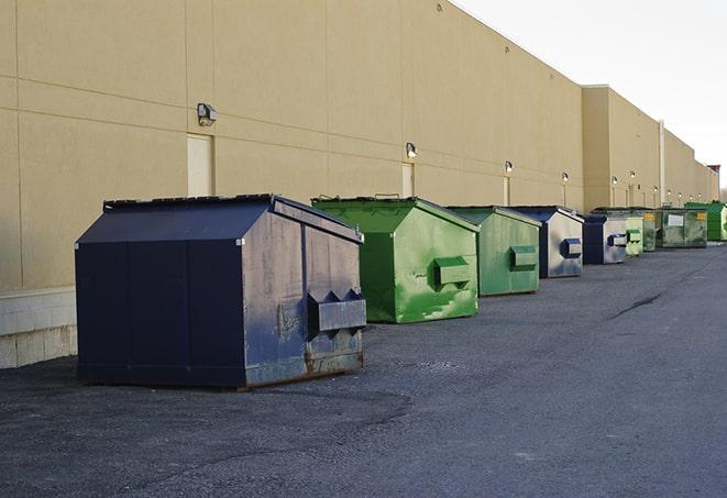 dumpsters lined up waiting to be filled with construction waste in Cerrillos